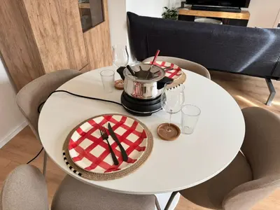 a white table with a cake and glasses on it at Alte Näherei in Degersheim