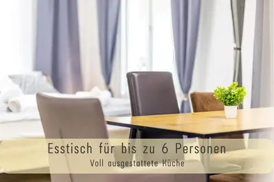 a dining room with a wooden table and chairs at Modern 80qm Flat with Balcony & free Parking in St. Gallen