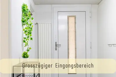 a glass case with a door and a plant at Modern 80qm Flat with Balcony & free Parking in St. Gallen