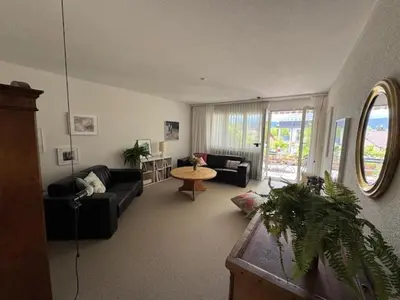 a living room with a couch and a table at 3 Zimmerwohnung mit Gartenterrasse, mitten im idyllischen Gais für 1 bis 3 Personen in Gais