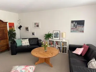 a living room with a couch and a table at 3 Zimmerwohnung mit Gartenterrasse, mitten im idyllischen Gais für 1 bis 3 Personen in Gais