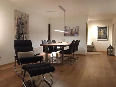 a dining room with a table and chairs at Apartment Chäserruggblick by Interhome in Unterwasser