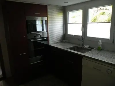 a kitchen with a sink and a microwave at Holiday Home Neuer Sigerst by Interhome in Wildhaus