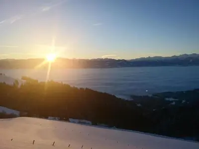 a view of the sun setting over a body of water at Apartment Rheintalblick by Interhome in Oberegg