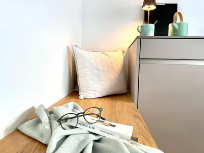 a pair of glasses sitting on the floor next to a pillow at Apartment im Dorf Urnäsch by Interhome in Urnäsch