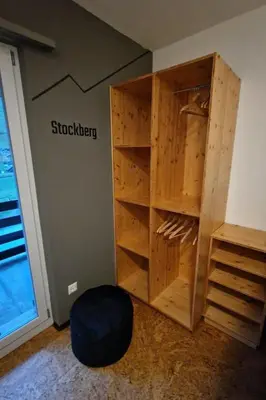 a room with a wall with a book shelf at Holiday Home Ski- und Gruppenhaus by Interhome in Alt Sankt Johann