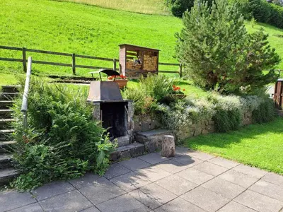 a garden with a wood stove in a field at Apartment Bijou by Interhome in Alt Sankt Johann
