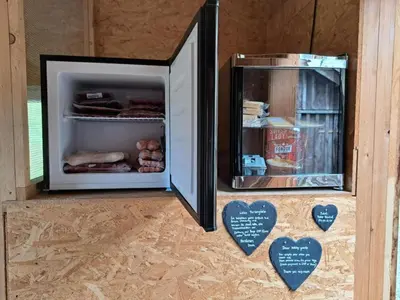 a picture of a refrigerator with some food in it at Apartment Ferien im Gugger - Wohnung Stockberg by Interhome in Nesslau