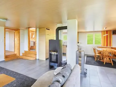 a living room with a couch and a table at Apartment Hof Höchi by Interhome in Bruggen