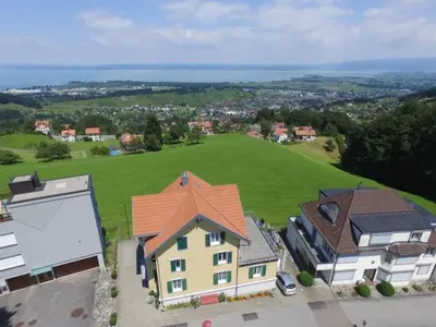 an aerial view of a house with a green field at Apartment Rätia by Interhome in Wolfhalden