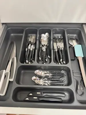 a tray filled with utensils in a sink at McNeal Solutions Zentrale Lage direkt am Roten Platz in St. Gallen