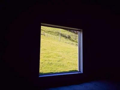 a window with a view of a field of grass at Holiday Home Tiny Hause by Interhome in St. Gallen