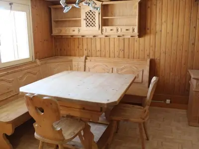 a wooden table and chairs in a room at Holiday Home Ferienhaus- - Stöckli Klingenbuch 20 by Interhome in Rehetobel