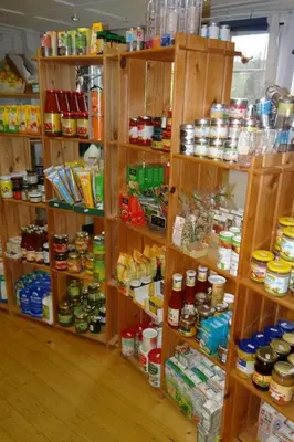 a room filled with wooden shelves filled with food at Apartment Hof Bommes by Interhome in Gais