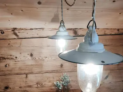 two white lights hanging from a wooden wall at Apartment Bauernhaus VordereAu by Interhome in Schwellbrunn