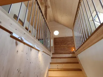 a staircase in a house with wood paneling at Apartment Bauernhaus VordereAu by Interhome in Schwellbrunn