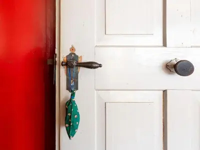 a door knob with a tie hanging from it at Holiday Home Lindeli by Interhome in Sankt Peterzell