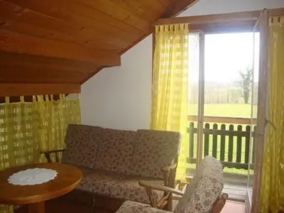 a living room with a couch and a table at Holiday Home Alten-Hof by Interhome in Bischofszell