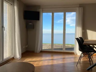 a living room with a view of the ocean at Apartment Seehof by Interhome in Rorschacherberg