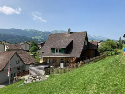 a house on the side of a hill at Apartment Sweet Home by Interhome in Wildhaus