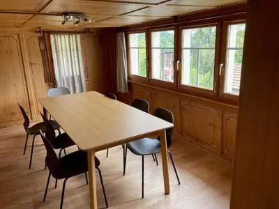 a dining room with a wooden table and chairs at Apartment Sweet Home by Interhome in Wildhaus