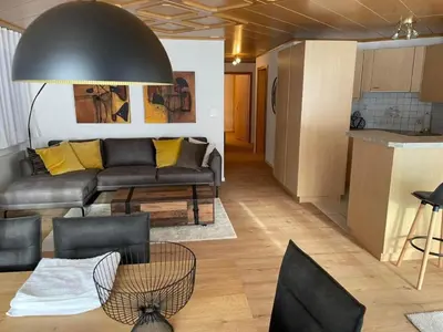 a living room with a couch and a table at Apartment Friedegg by Interhome in Wildhaus