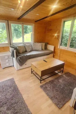 a living room with a couch and a coffee table at Holiday Home Bienenhaus Speicher by Interhome in Speicher