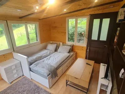 a room with a bed in a tiny house at Holiday Home Bienenhaus Speicher by Interhome in Speicher