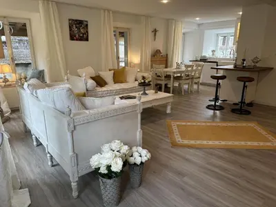 a living room with couches and a dining room at Apartment Allegra Appenzell by Interhome in Trogen