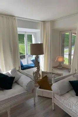 a living room with two white couches and two windows at Apartment Allegra Appenzell by Interhome in Trogen