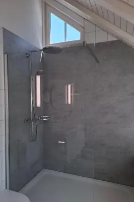 a bathroom with a shower with a glass door at Apartment Zwingli's Ferienwohnung by Interhome in Nesslau