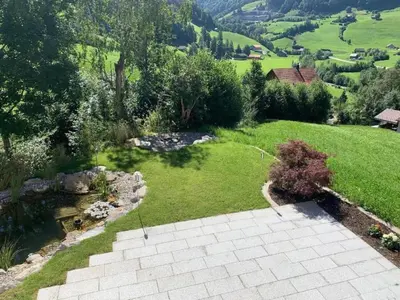 an aerial view of a garden with a pond at Holiday Home Ferienhaus by Interhome in Nesslau