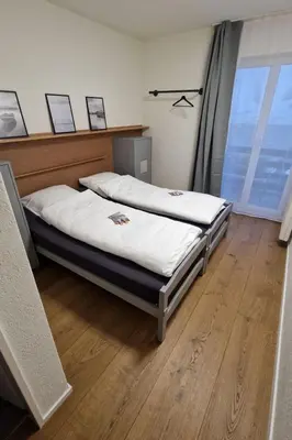 a bedroom with two beds and a window at Apartment Terrasse & Pistenähe by Interhome in Alt Sankt Johann