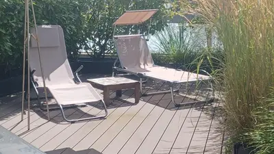 a bedroom with a bed with two pillows on it at Comfort Rooms mit Whirlpoolzugang in Romanshorn