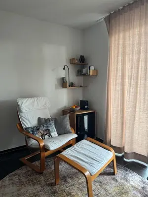 an open sliding glass door to a balcony at Comfort Rooms mit Whirlpoolzugang in Romanshorn