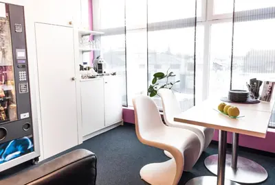 a dining room with a table and chairs at Sky Design Motel in Kriessern