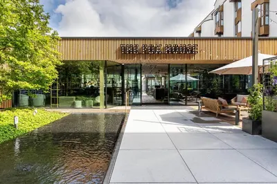 a billiard room with a pool table and chairs at Revier Hotel Säntispark in St. Gallen