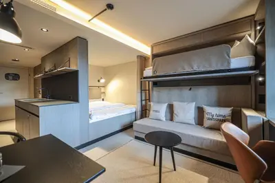 a bathroom with a sink and a toilet and a shower at Revier Hotel Säntispark in St. Gallen