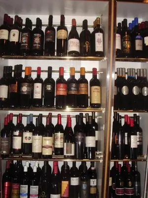 a shelf filled with lots of bottles of wine at Landgasthof Winzelnberg in Egnach