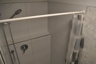 a bathroom with a shower with a shower curtain at Loft AR in Bühler