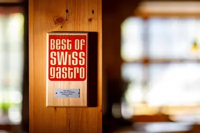 a sign that says best of swiss casserota on a wall at Hotel Hirschen Wildhaus in Wildhaus