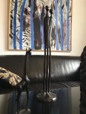 a statue of a man and a giraffe on a table at BnB chezlise in Urnäsch