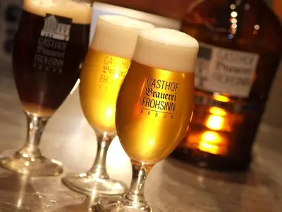a group of three glasses of beer on a table at Hotel Brauerei Frohsinn in Arbon