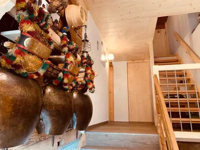 a room with large copper vases on the wall at Hof Dietrich in Herisau