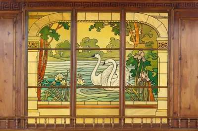 a window with a painting of two swans in the water at Linde Heiden Swiss Quality Hotel in Heiden