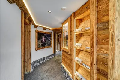 a hallway with wood paneling and a wall at Hotel Landgasthof Eischen in Appenzell