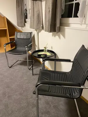 two chairs and a table in a room at Hotel Landgasthaus Neues Bild, Eggerstanden in Appenzell