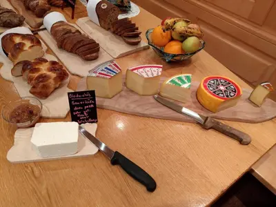 a table with different types of bread and other foods at Gasthaus Schäfli in Alt Sankt Johann