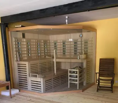 a room with a large glass window with a chair at Bodensee Moosburg Biohof am See in Güttingen