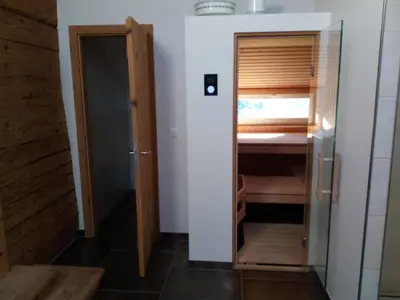 a small room with a closet and a door at Ferienhaus Brand in Gais